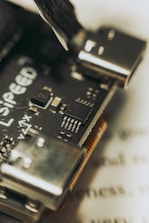 Close-up of a microcontroller board with various components soldered.