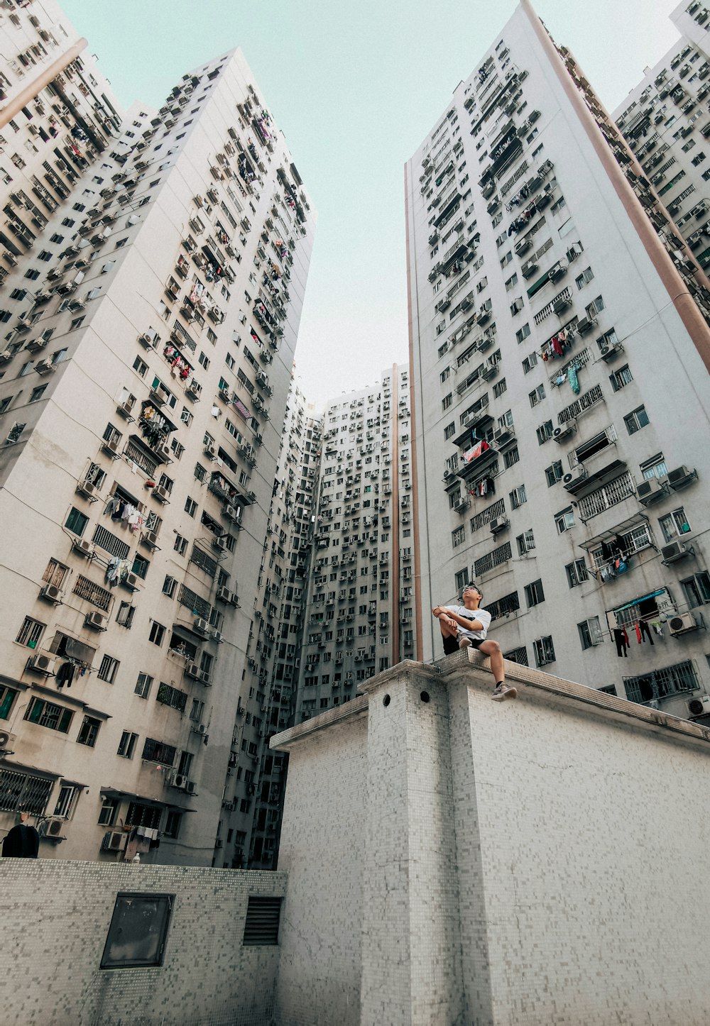 a person sitting on a ledge