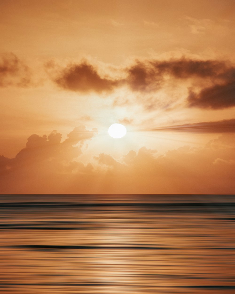 a sunset over a beach