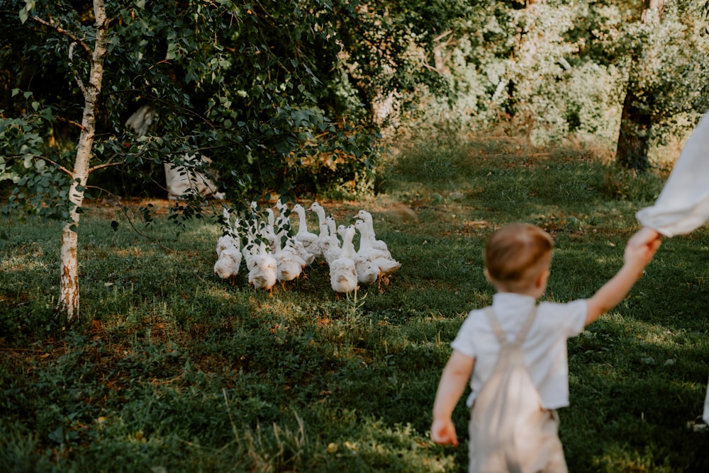 a child running in a grassy area