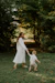 a man and a child walking in a park