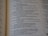 A close-up of a page from a book written in verse format, containing numbered lines of text. The text is organized in a poetic style, with a clear structure and alignment.