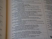 A close-up of a page from a book written in verse format, containing numbered lines of text. The text is organized in a poetic style, with a clear structure and alignment.