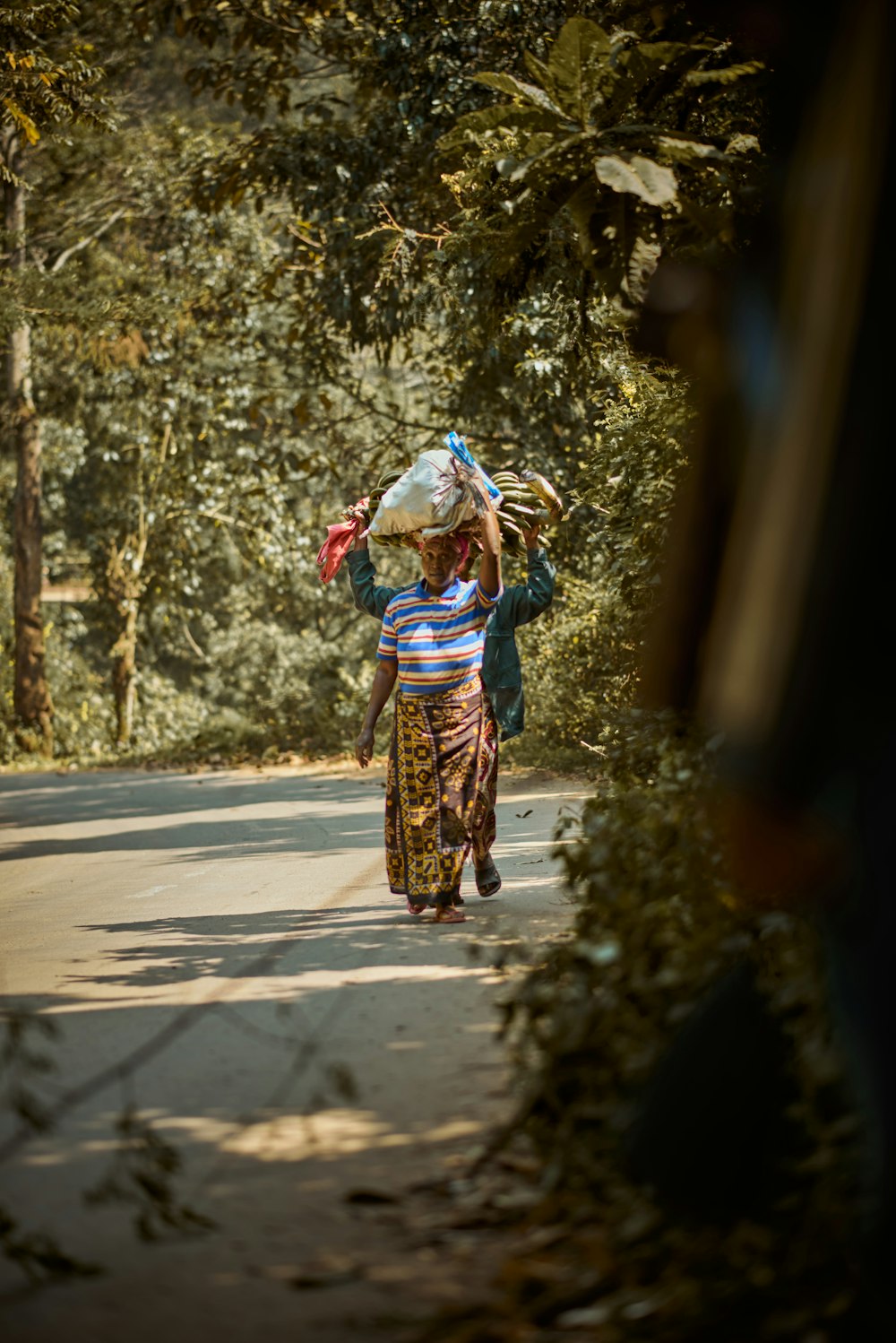 a person carrying a child on the back