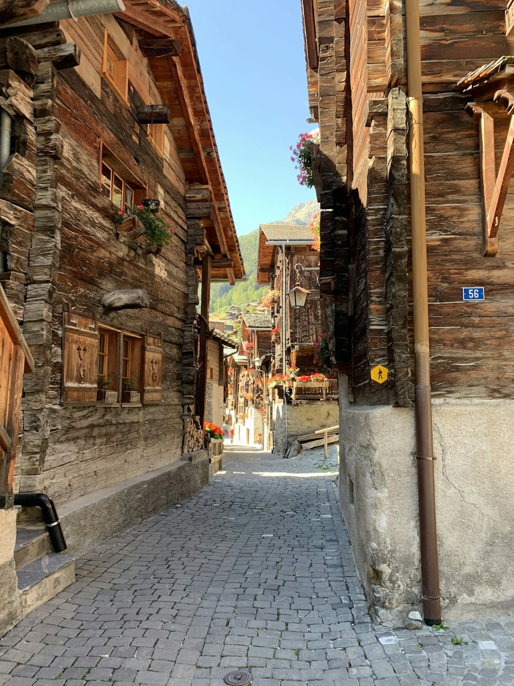 a cobblestone street with buildings on either side of it