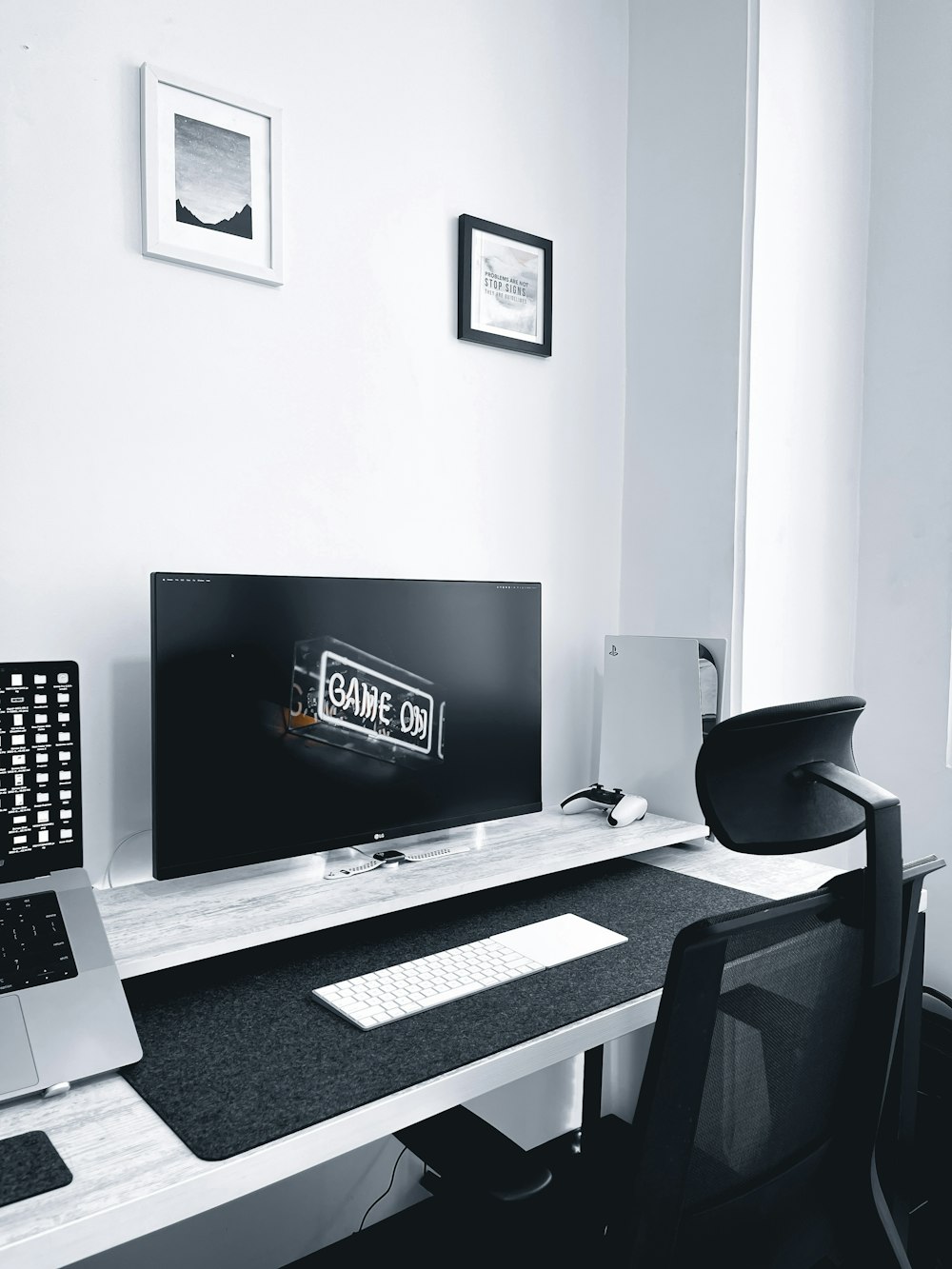 a computer desk with a monitor and keyboard