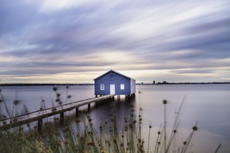 a small house on a dock