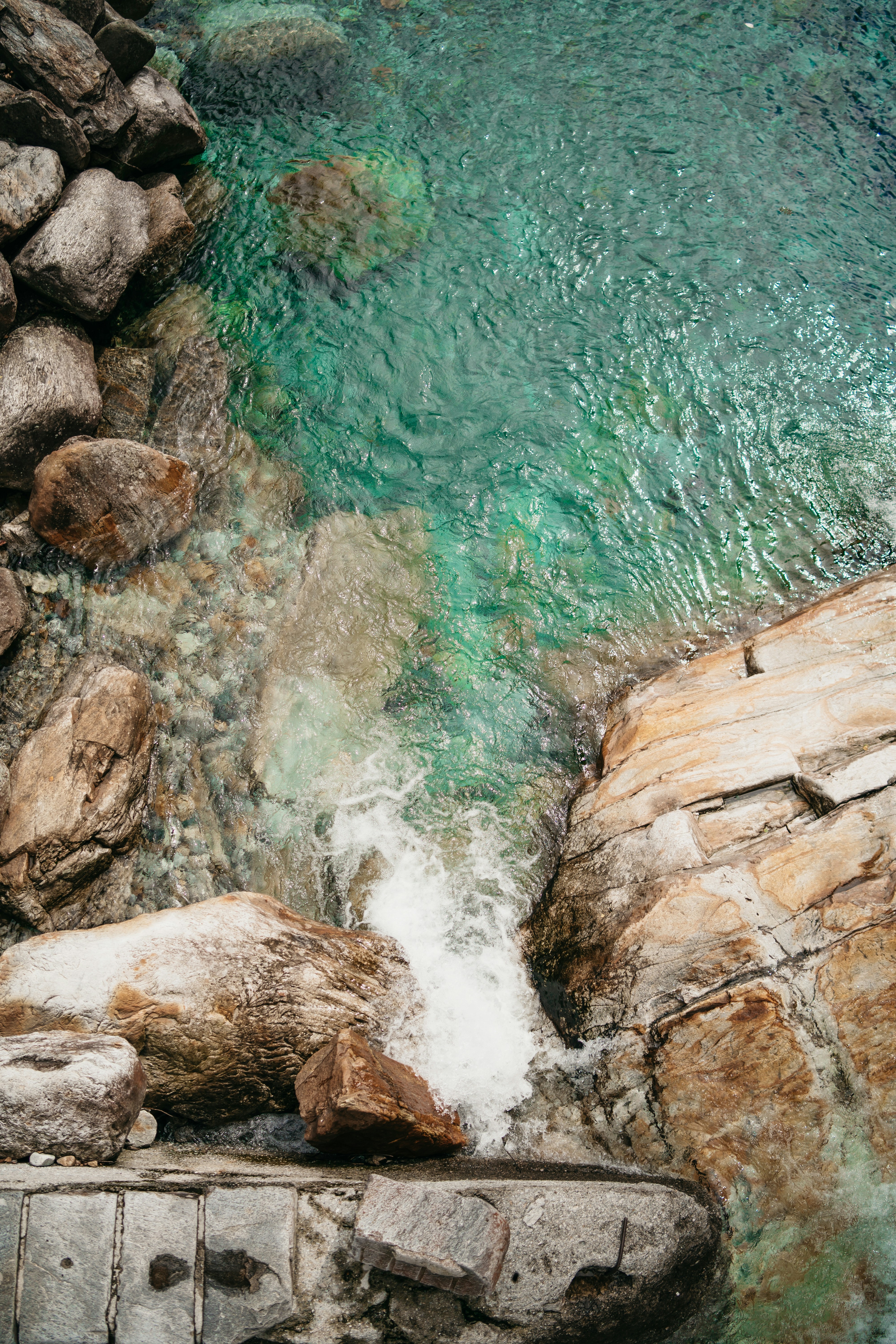 A waterfall over rocks photo – Free Grey Image on Unsplash