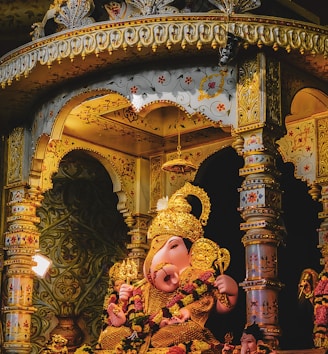 Warm, inviting interior of Ganesha Palace with colorful Indian decor and a bustling dining atmosphere.