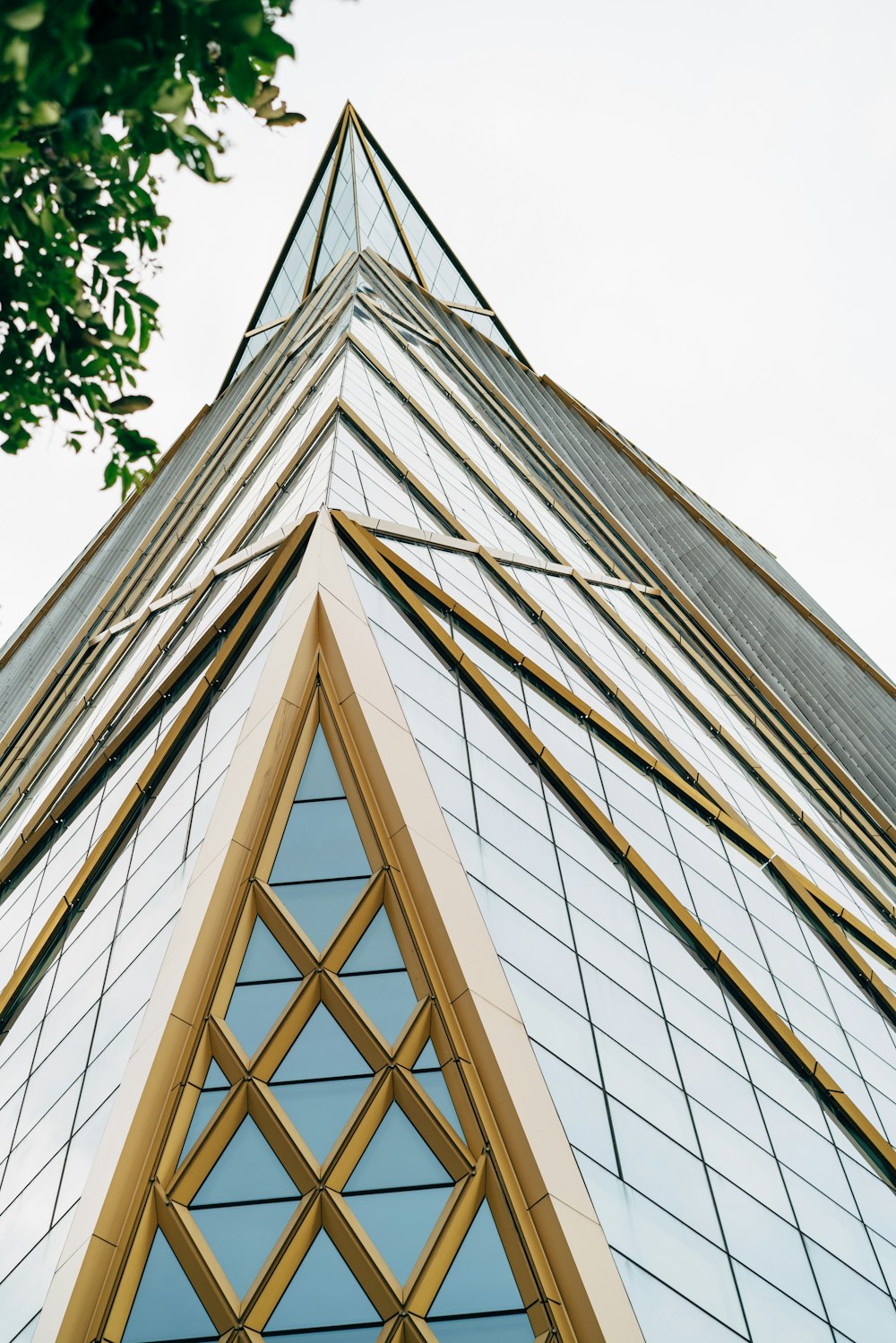 a tall building with a triangular roof