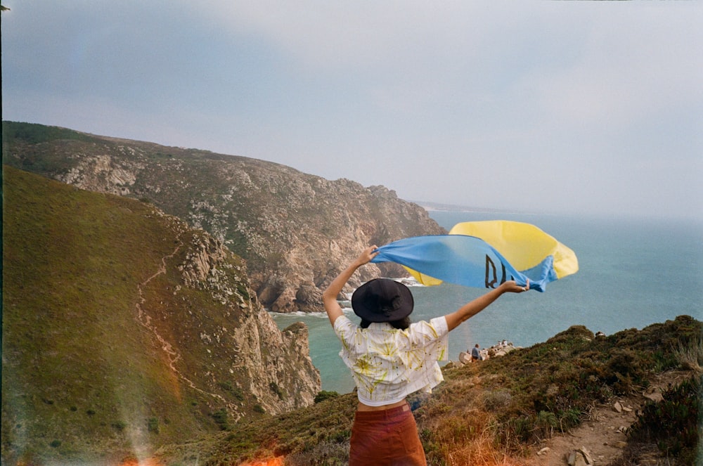 a person holding a yellow umbrella