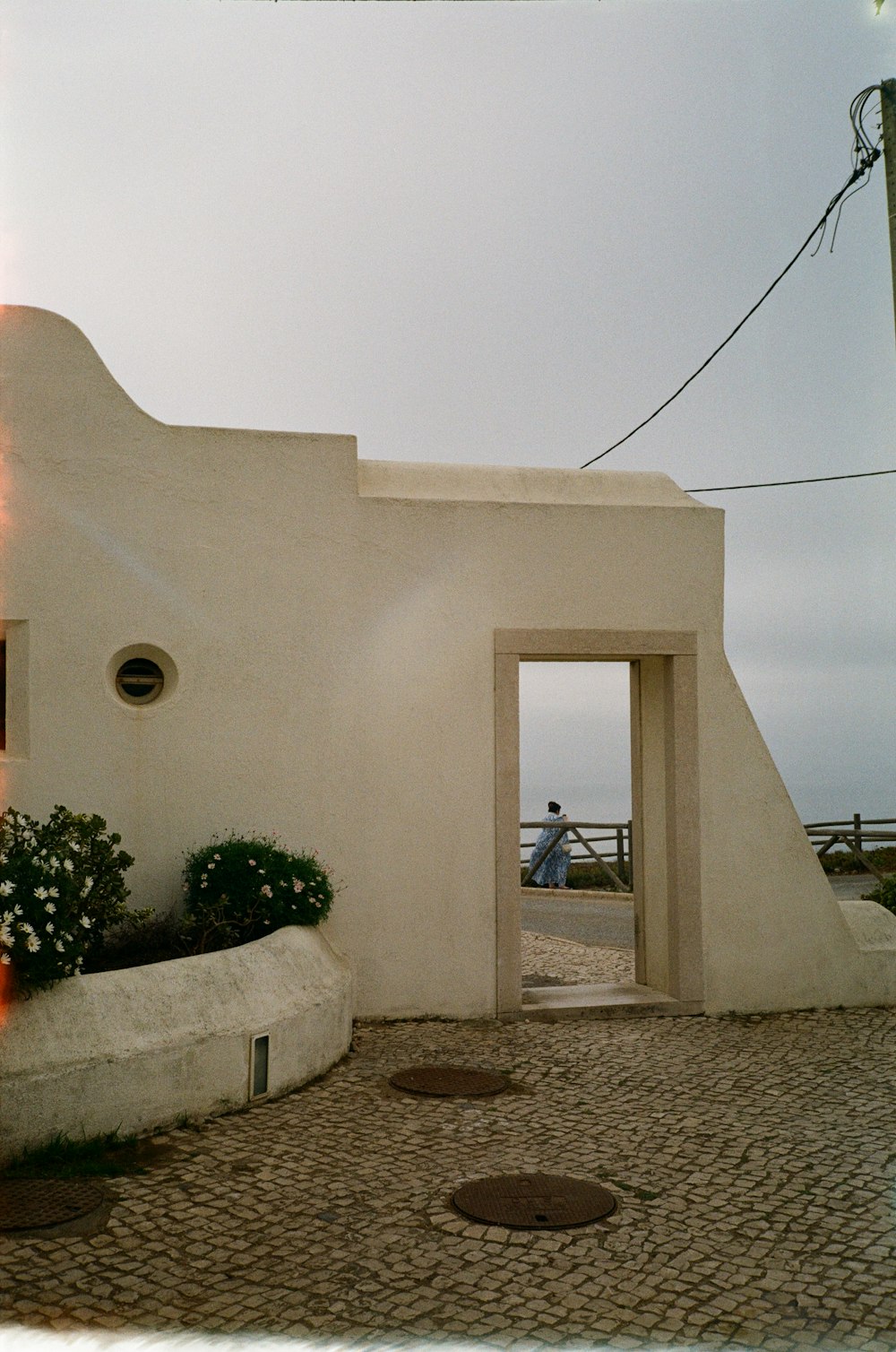 a person standing in a doorway of a building