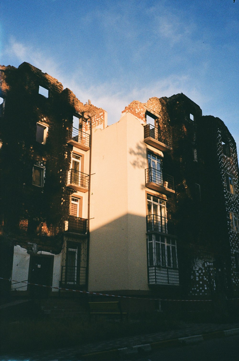 a building with a hill in the background