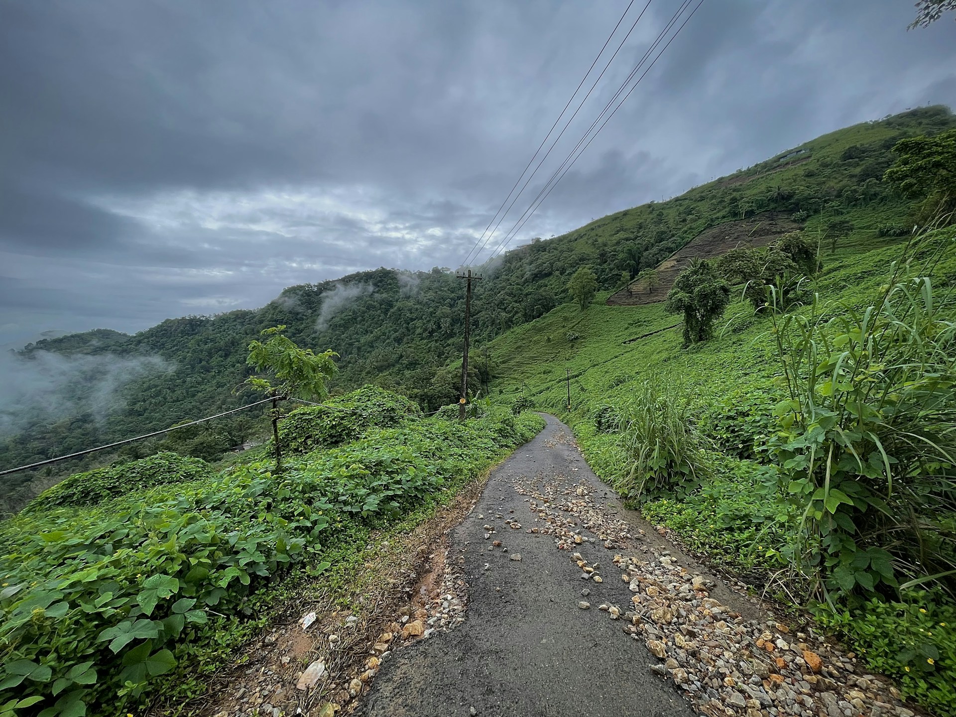 a dirt road in a hilly area