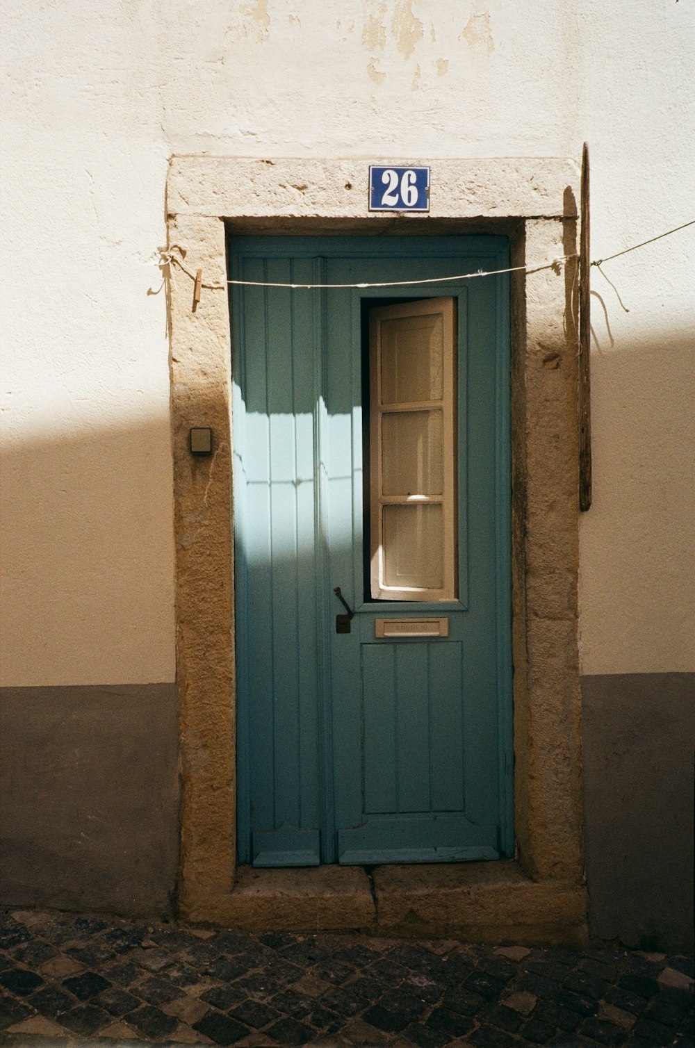 a blue door with a window