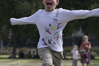 A happy child running outdoors wearing colorful, comfortable metrosfits clothing.