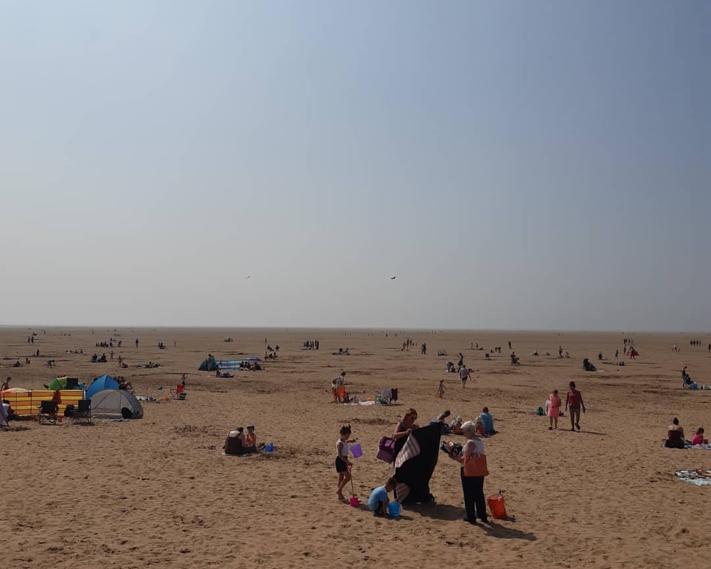 a group of people at a beach