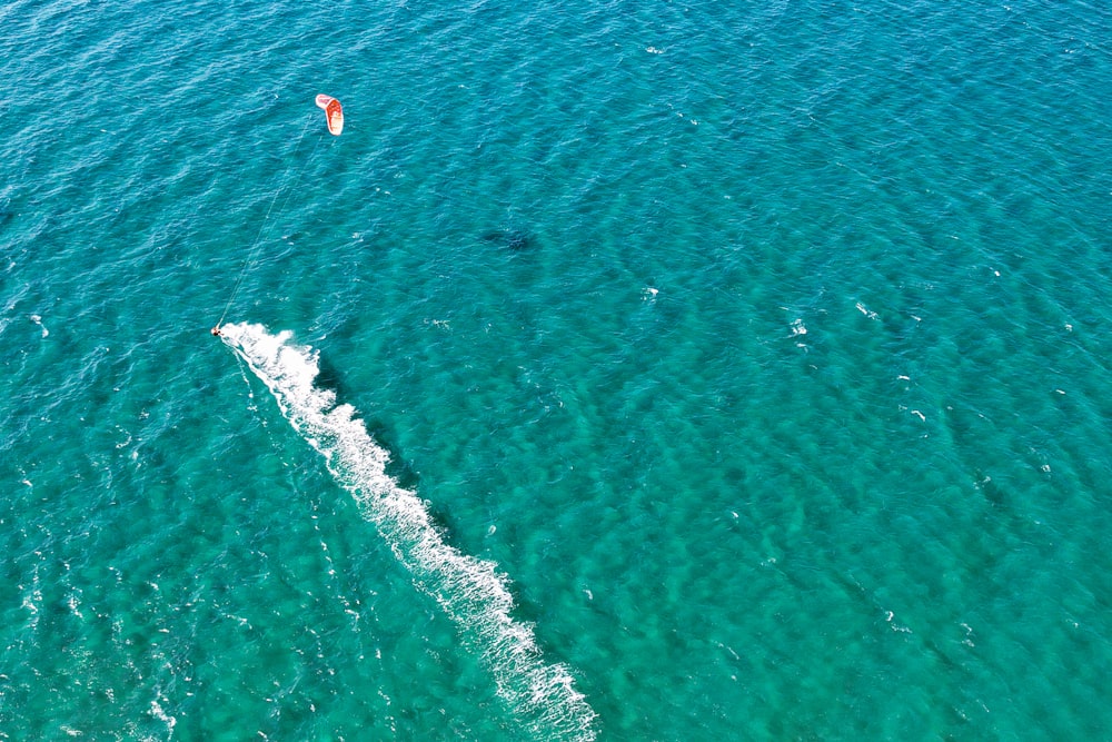 a person parasailing on the ocean
