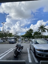 A car and bike parked safely, symbolizing vehicle insurance coverage.