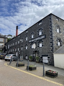 the Oban Distillery with cars in front
