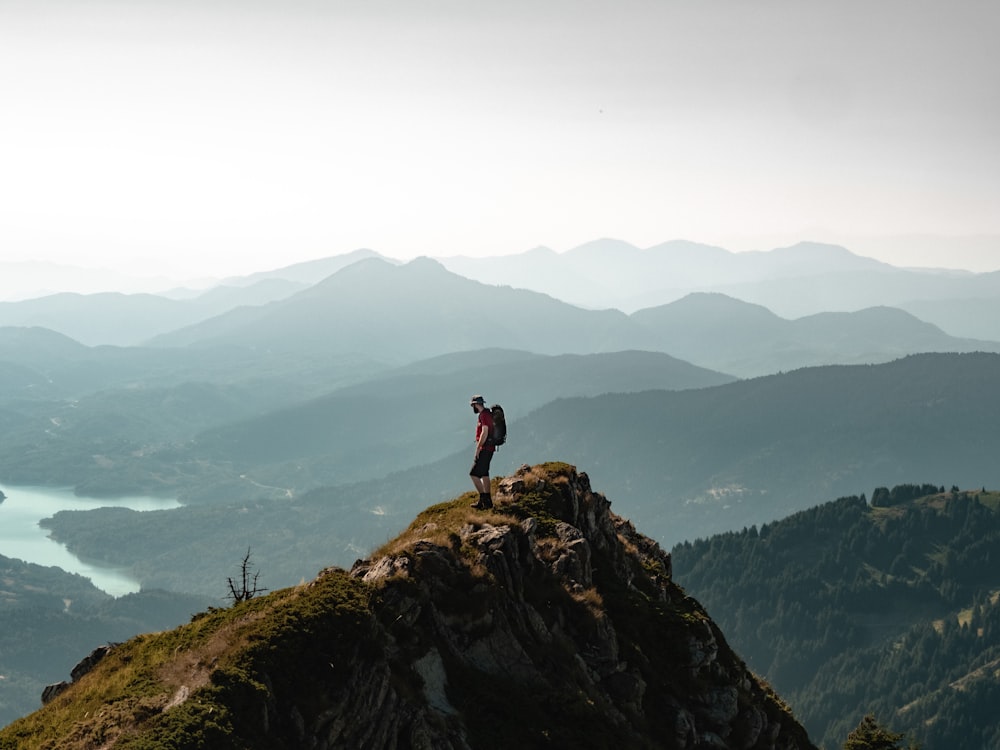 a person standing on a rock