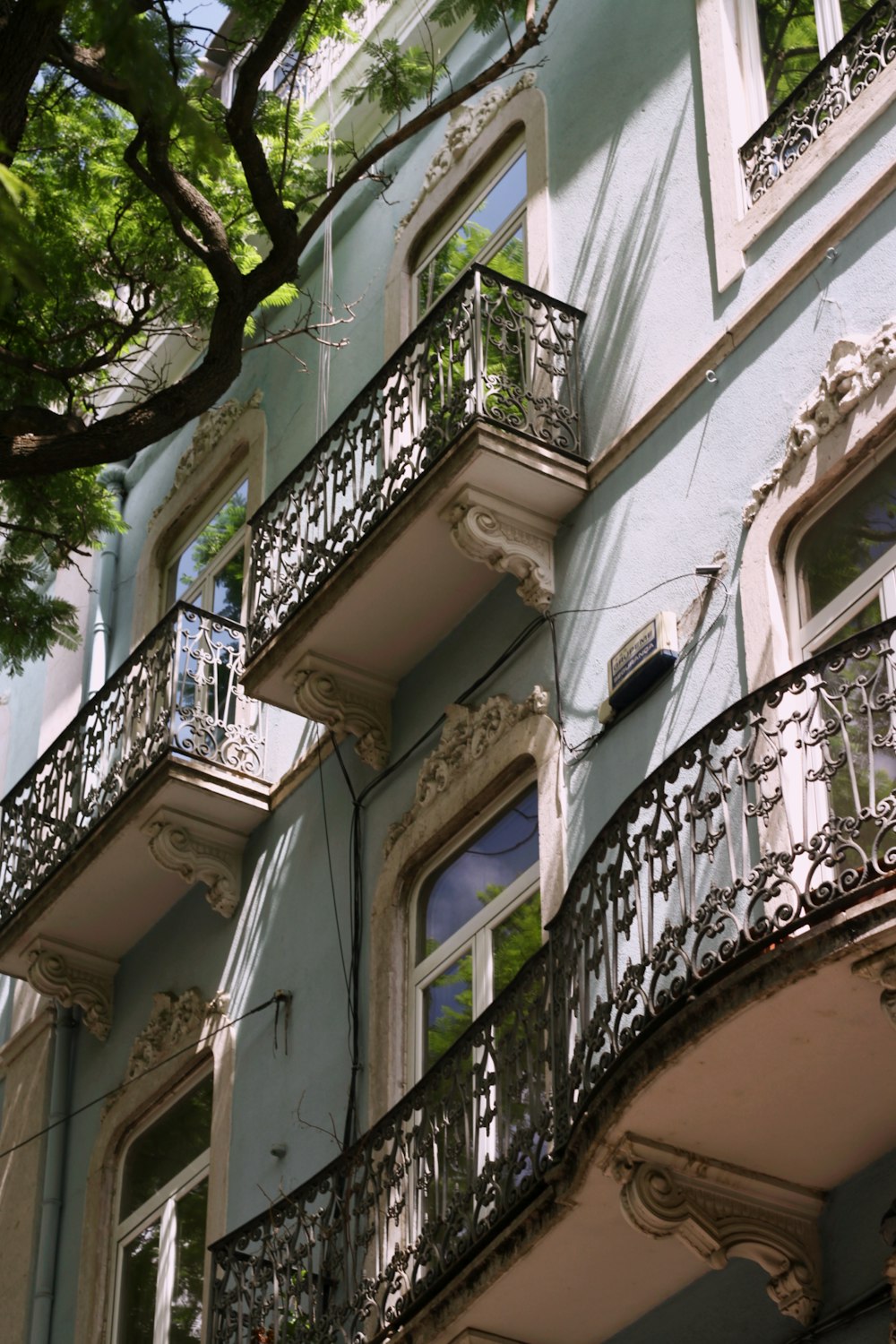 a building with a tree in the front