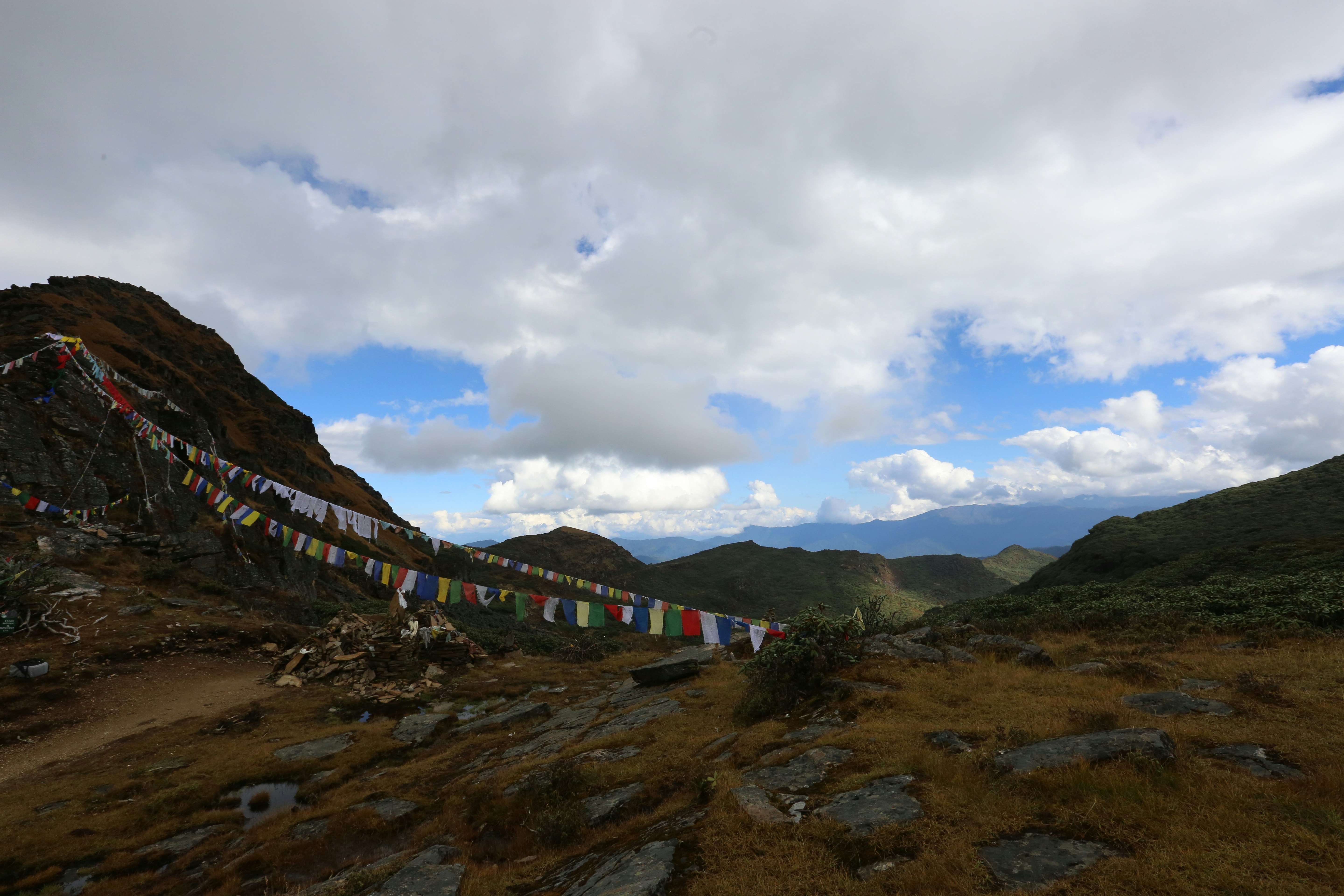 a group of people on a mountain, Druk Path Trek, Phajoding