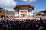 a large crowd of people in front of a building