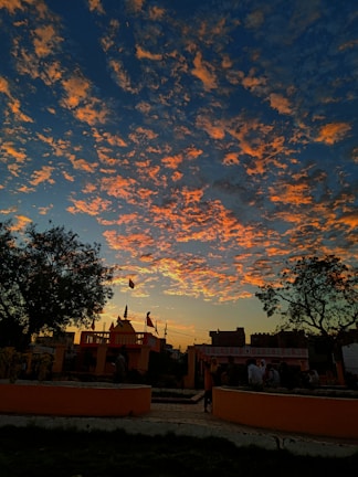 A vibrant sunset over Triveni Sangam, signifying unity.