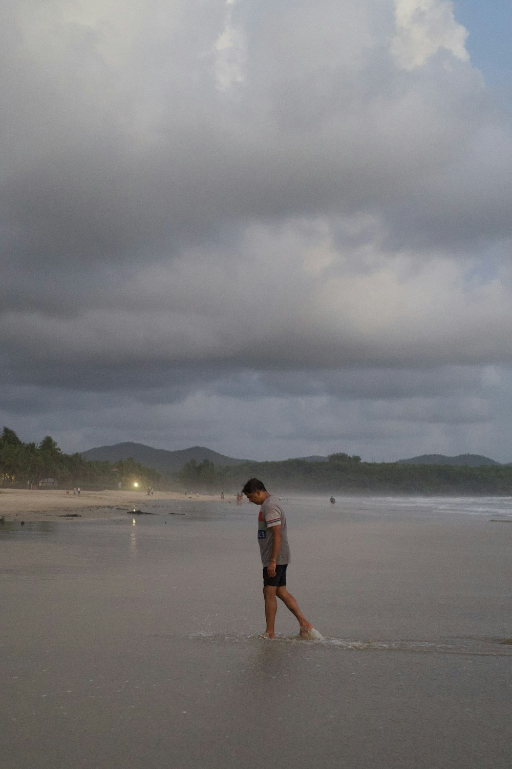 a man walking on a beach