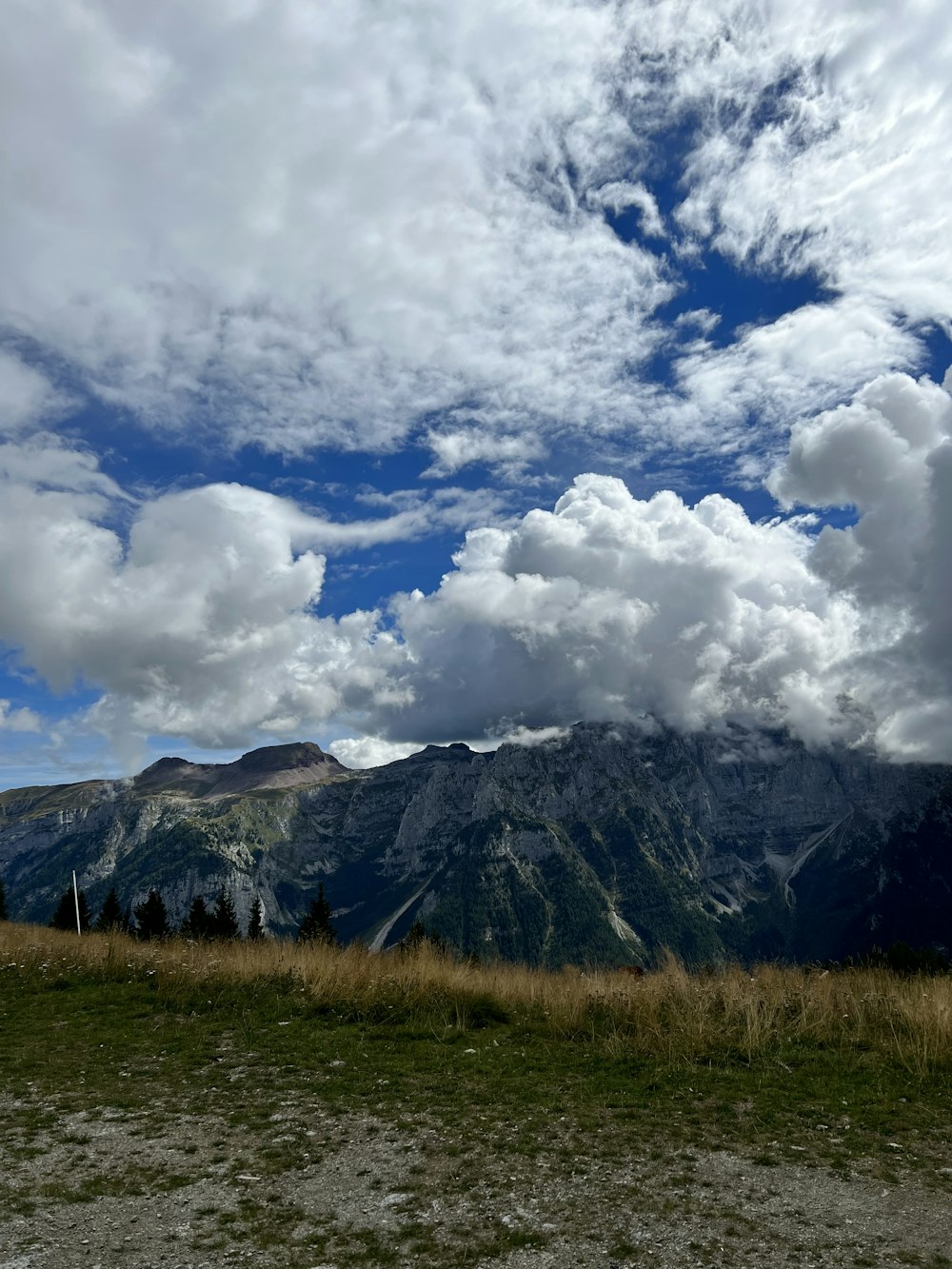 a landscape with mountains and clouds