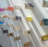 Artistic display of graphic novels and comic books arranged on a stylish shelf.