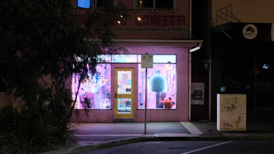 A small business storefront with a glowing map pinpoint highlighting local search