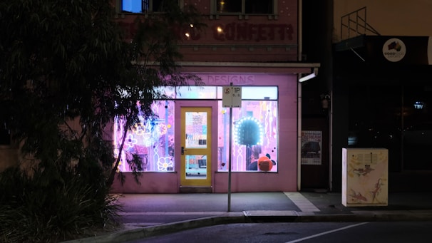 A small business storefront with a glowing map pin hovering above it, symbolizing local SEO.
