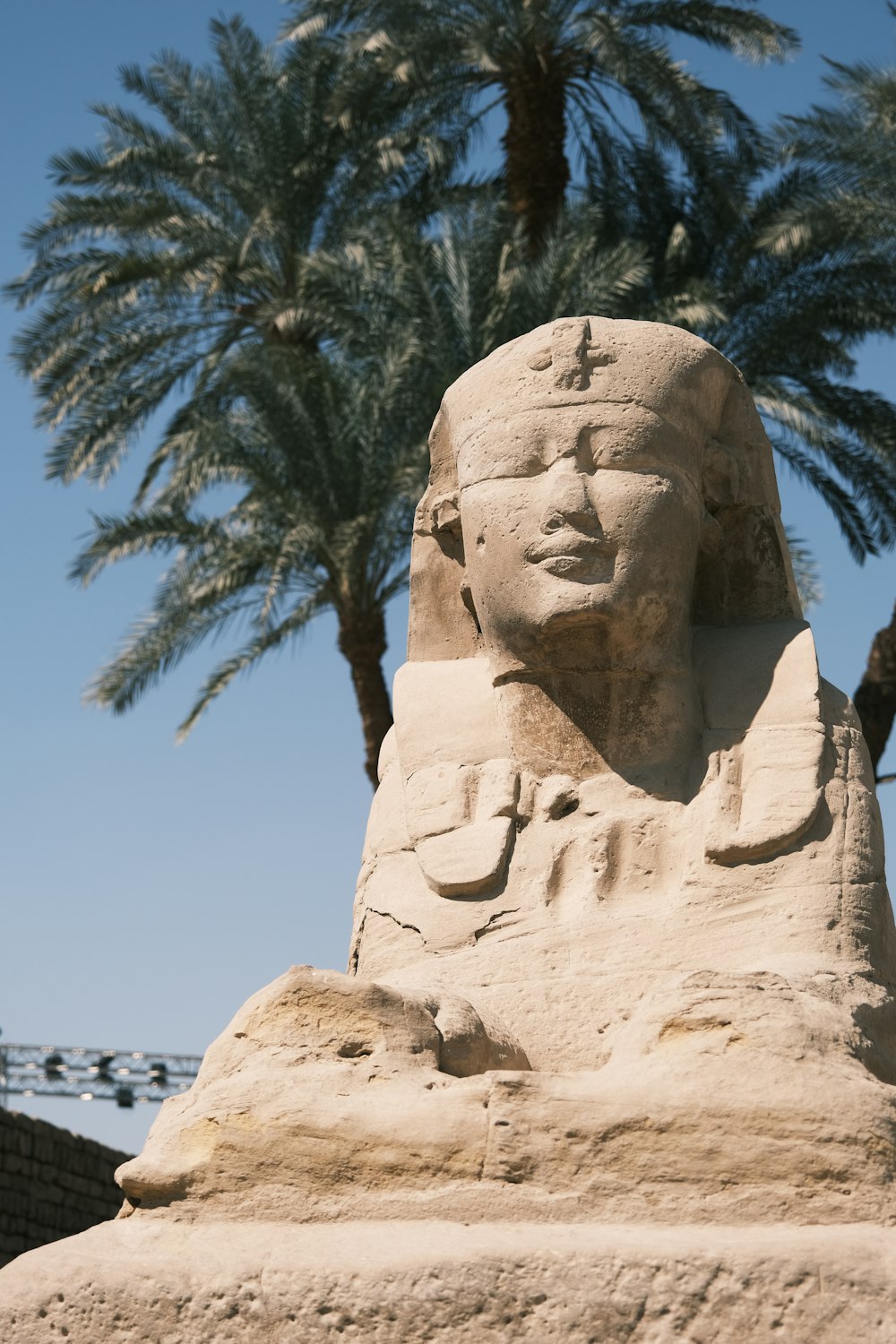 a large rock with a face carved into it