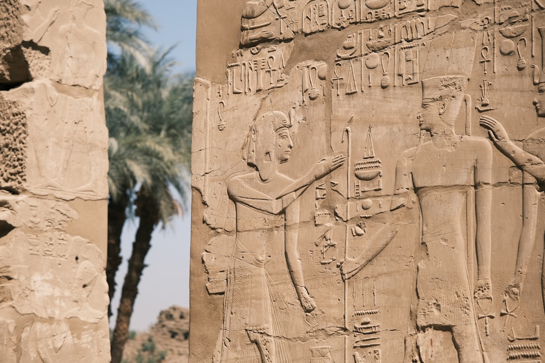 a stone wall with carvings,