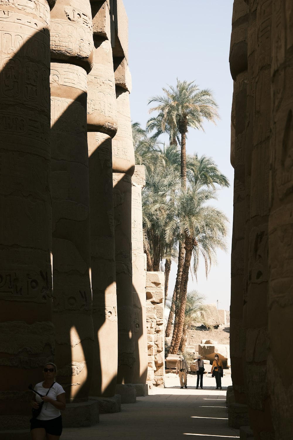 a person standing between stone pillars