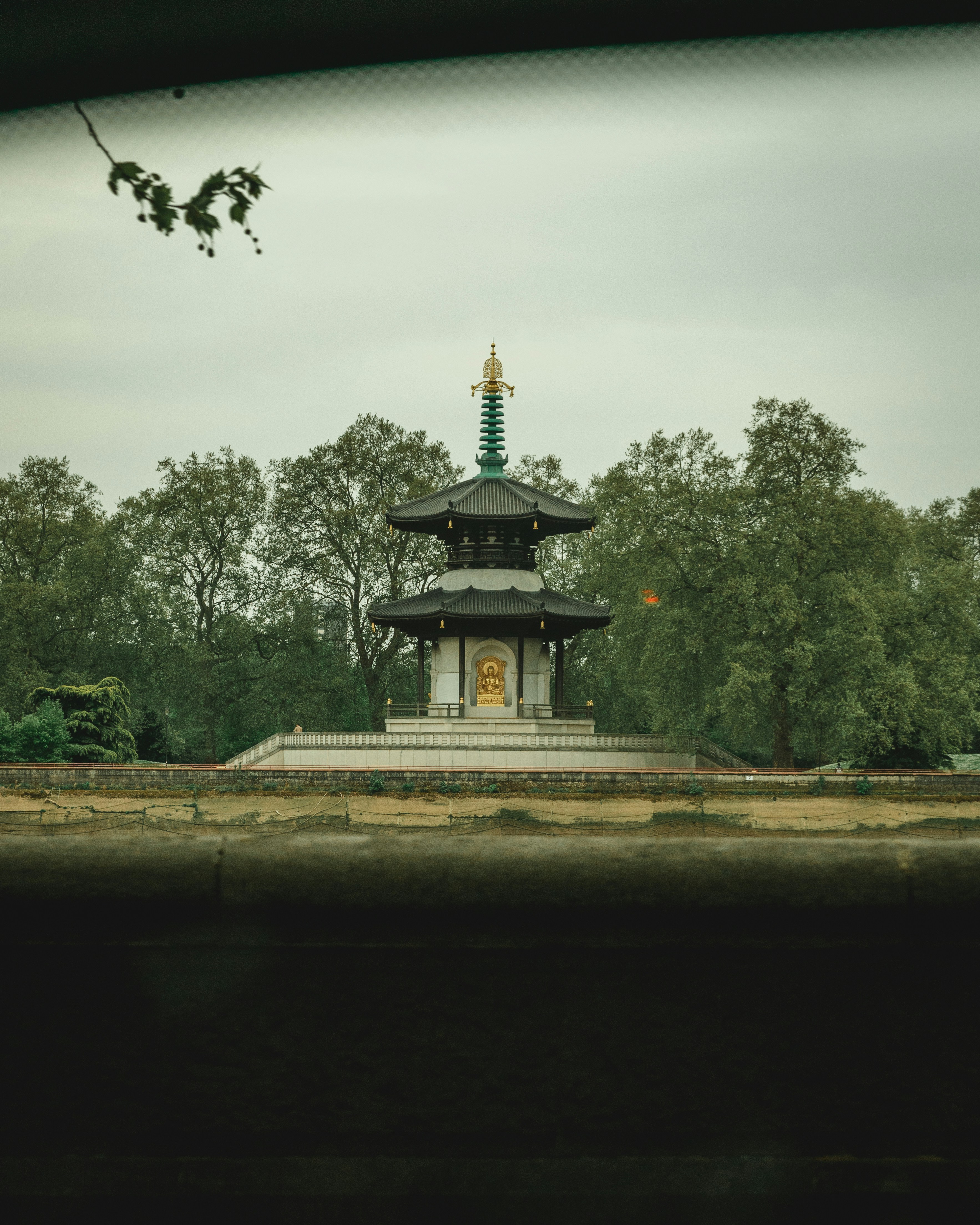 a building with a tower and trees in the background