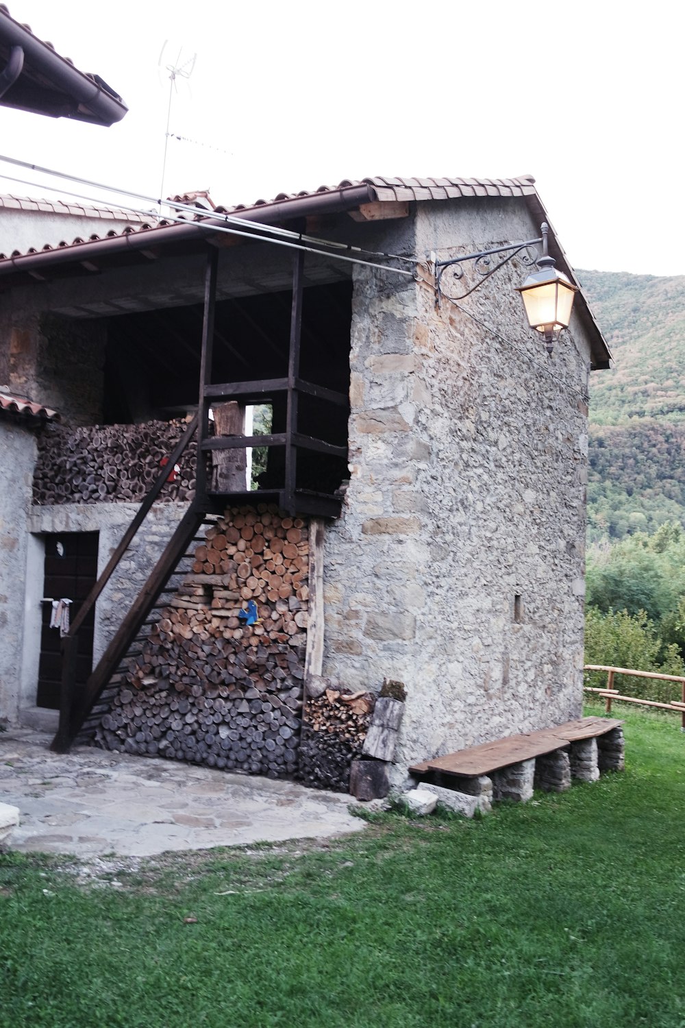 a stone building with a stone wall