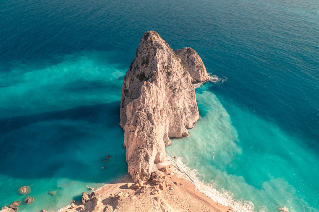 a rock in the water, Mykonos viewspot of the virgin beach