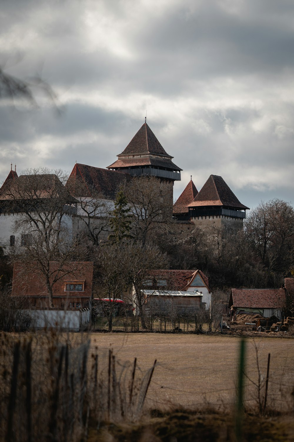 a group of buildings with a fence in front of them