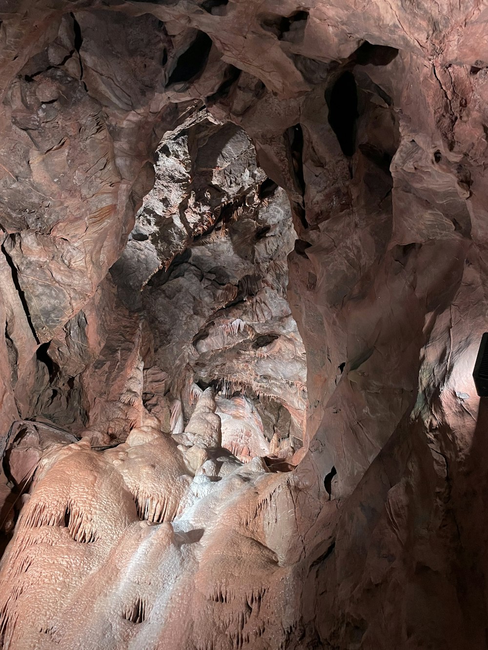 a group of people climbing a rock