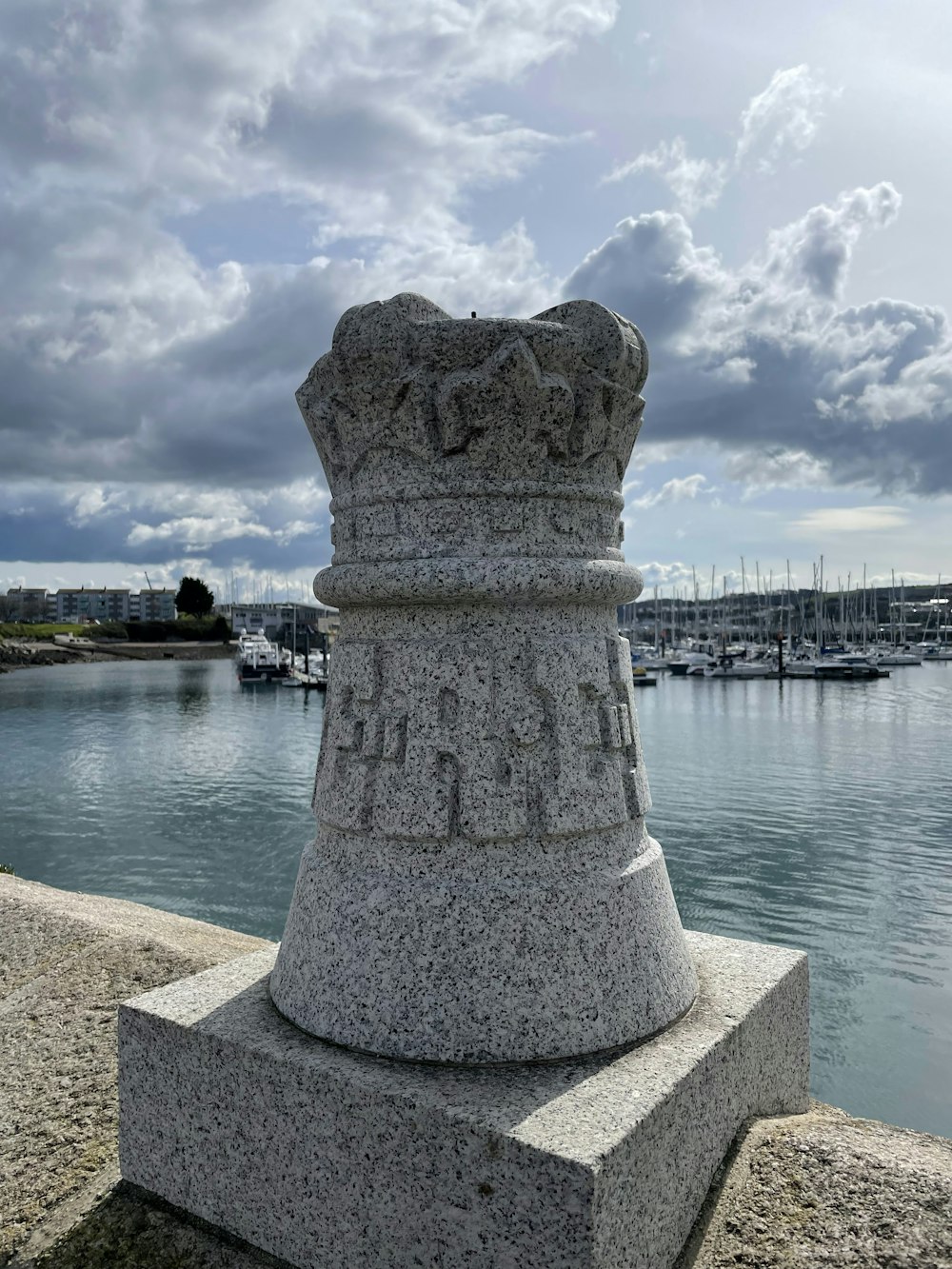 a stone pillar on a dock