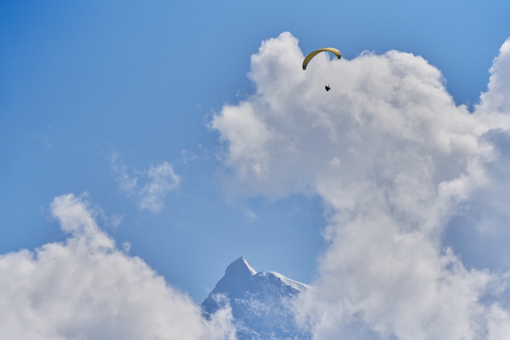 a person parachuting in the sky