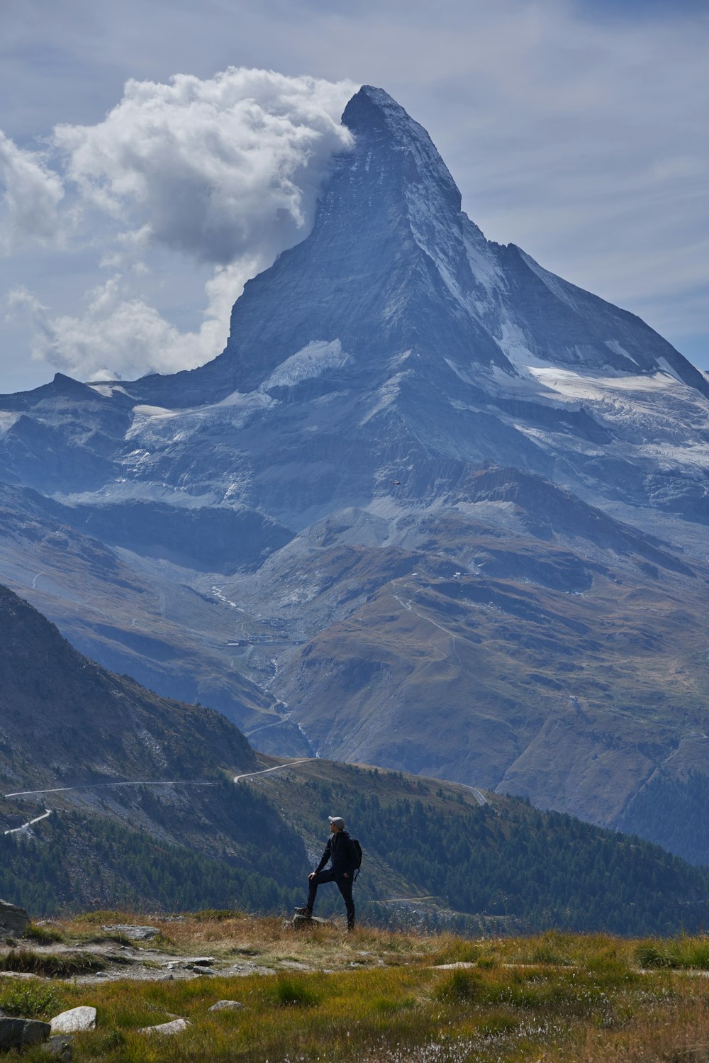 a man walking on a mountain