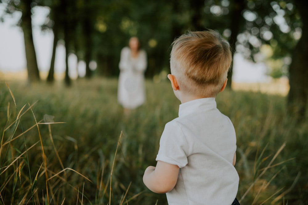 a boy looking at a person