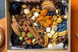 A selection of premium hampers showcasing a variety of gourmet snacks and luxury items.