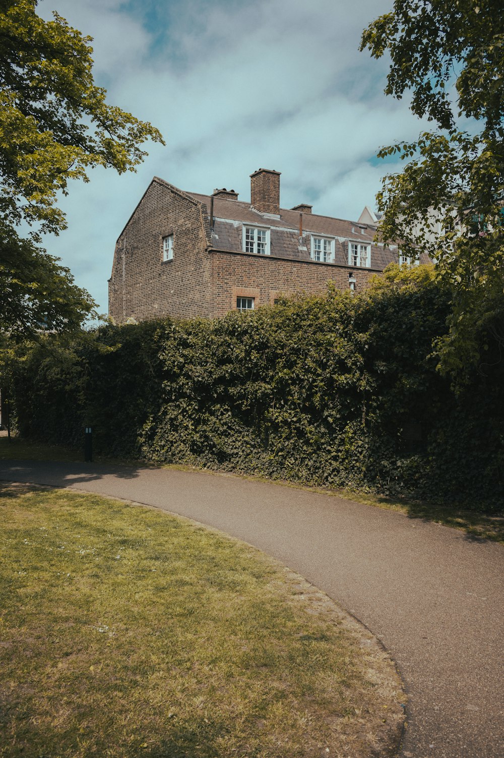 a large brick building with a driveway