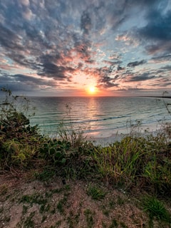 a sunset over a body of water