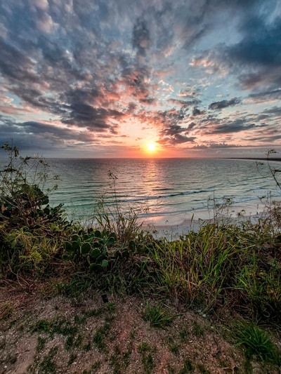 a sunset over a body of water